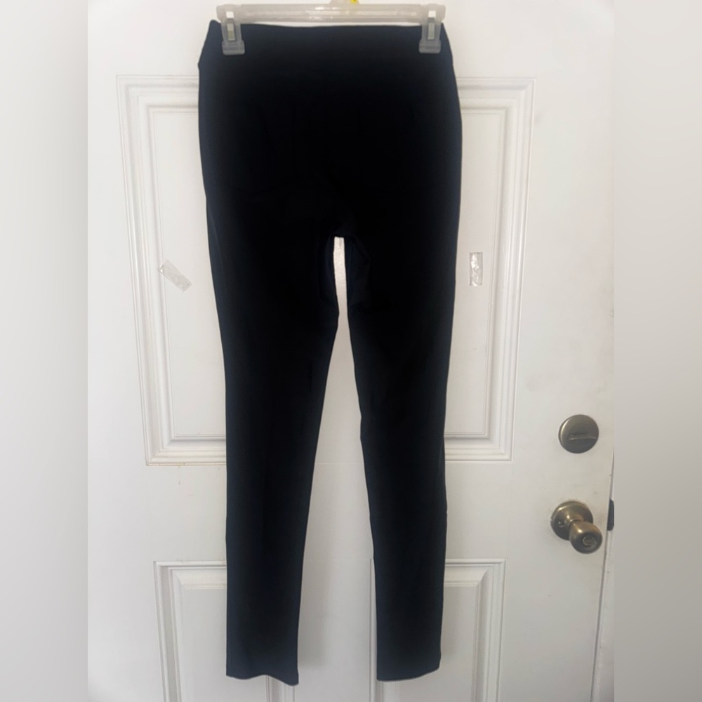 Black Leggings with pockets and zip up front.